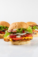 three differents burgers, white background, white reflection