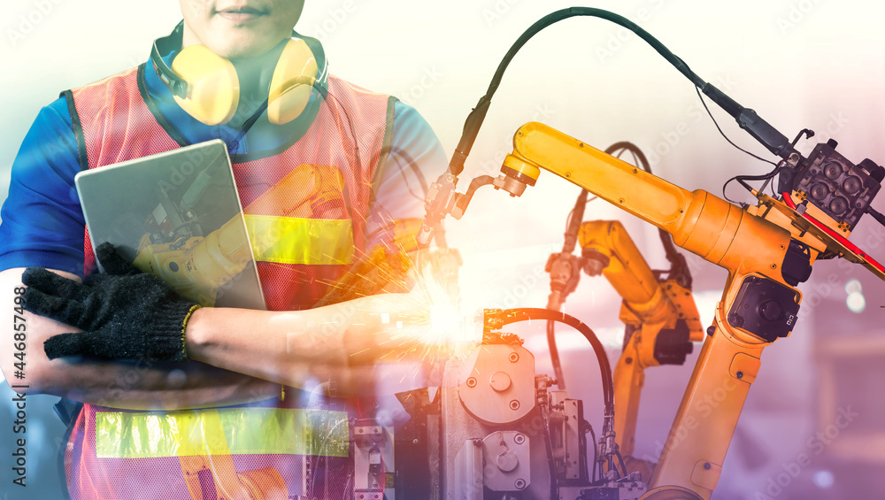 Poster mechanized industry robot arm and factory worker double exposure . concept of robotics technology fo