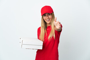 Pizza delivery woman holding a pizza isolated on white background shaking hands for closing a good...
