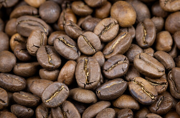 Background of Arabica coffee beans in close-up.
