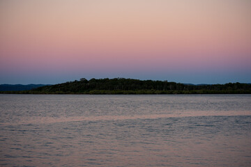 View across the bay  from River Heads toward Fraser Island at dusk