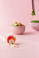 sushi, sushi salad, pink background. japanese food