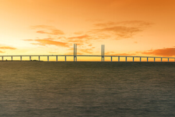Fototapeta na wymiar Oresund Bridge connecting Denmark and Sweden at sunset - Malmo, Sweden