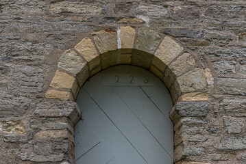 ancient stone arch over a doorway