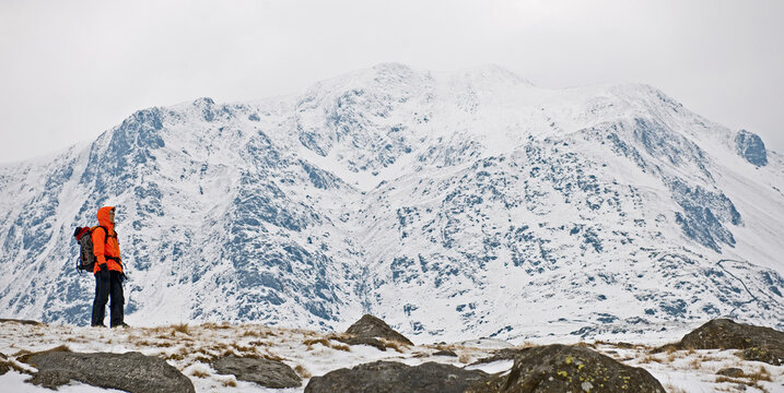 woman hiking around Mount Tryfan during winter