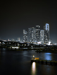 Fototapeta na wymiar skyline night Miami Florida sea downtown buildings bridge