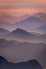 Beautiful view to colorful layers of mountains on sunrise