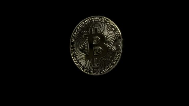 physical Bitcoin coin on a black background rotating slowly around. Virtual money. crypto currency.