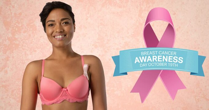 Animation of pink ribbon logo with breast cancer text over smiling woman in pink bra
