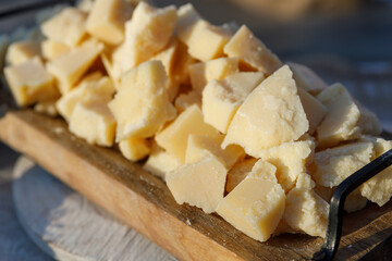 The cheese in the assortment lies on the table ready for use.
