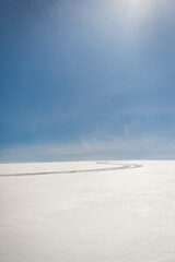 A ski track in the snow