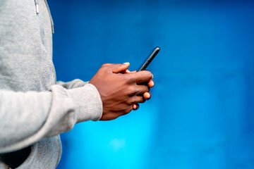 black person hand using his smartphone