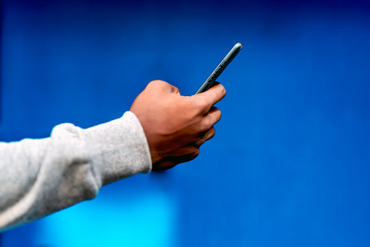 black person hand with smartphone