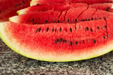 Sliced ​​watermelon on kitchen counter.