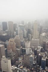 Fototapeta na wymiar Aerial view of contemporary megapolis on misty day