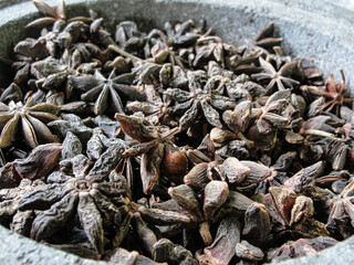 Asterisks of anise in stoneware on the market, macro photo, kind of close