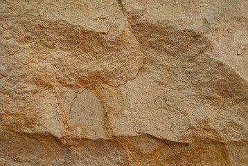 Sandstone wall background, relief texture, close-up view