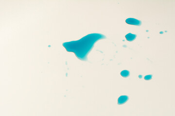 photo blue water or liquid splash residue on the white table.