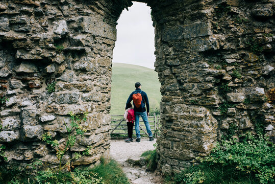 father and daughter exploring an English castle together happily