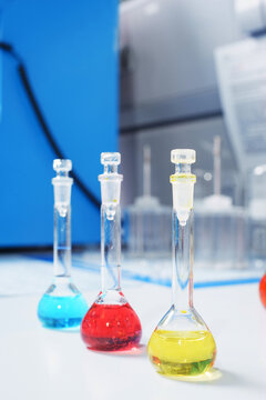Test tubes and flasks with test liquid on the table in a chemical lab