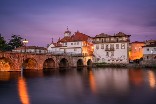 Chaves city view of historic buildings and church at sunset, Portugal