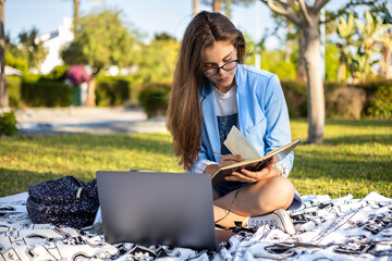Student girl using technology at garden