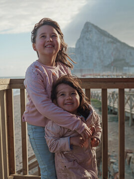 two girl against blue sky and mountain