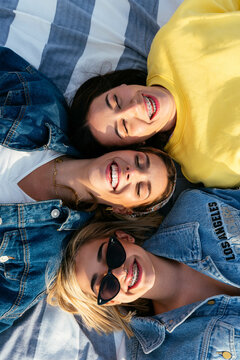 Overhead of best friends having fun on the beach
