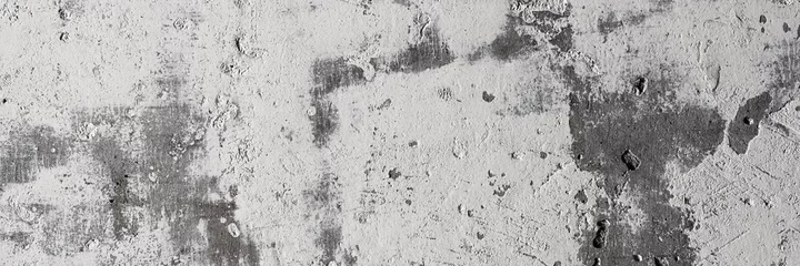 Textur der alten Betonwand. Raue graue Betonoberfläche mit weißen Flecken. Breiter Panoramahintergrund für Design. © Andrei Stepanov