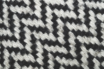 Wool carpet background. knitted rug close up