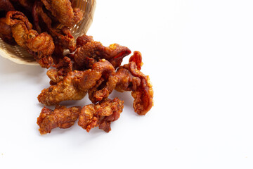 Chispy fried chicken skin on white background.
