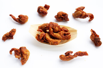 Chispy fried chicken skin on white background.