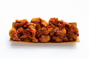 Chispy fried chicken skin on white background.