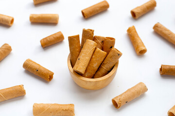Thai crispy coconut rolls on white