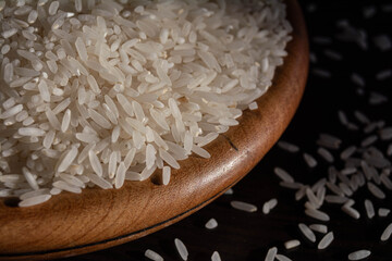 white rice on wooden bowl.