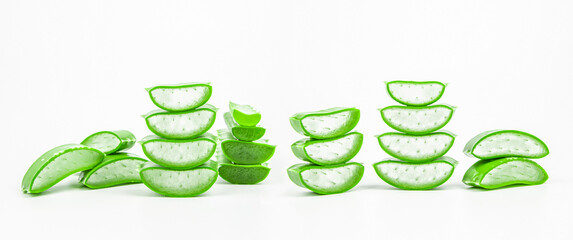 Aloe vera, Close-up slices of green fresh aloe vera plant stacked and aloe vera stalk or leaves with water dropping isolate on white background.