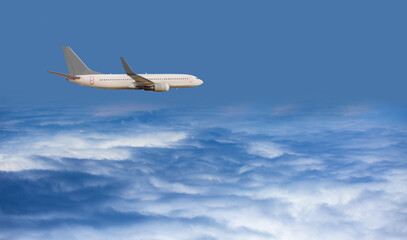 Fototapeta na wymiar A white passenger plane flying over storm clouds