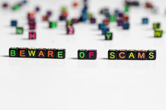 Beware of scams word on white background