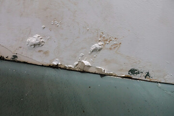 Water leaks on the roof of a building. Repair and improvement of the walls. Decaying from flood water. Leaky wet plaster on the roof of the house. Broken water leak on the wall. 