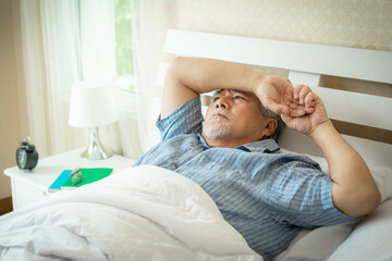 Senior man Suffering in bed cannot sleep from insomnia , Senior male , old man don't want to wake...
