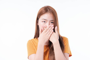 Asian girl used two hands closed covering his mouth for protection during the quarantine Coronavirus covid19 outbreak on white background , protect spread Covid-19