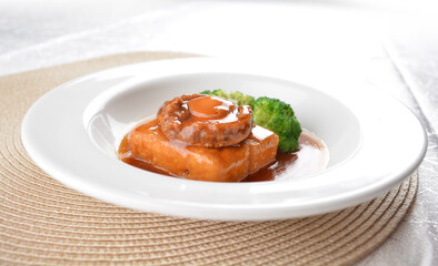 braised whole big abalone with bean curd tofu and broccoli in chef premium oyster sauce in white background asian halal seafood menu
