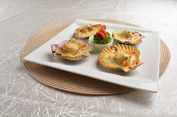 baked cheese cream scallop in shell foie gras canapés in white background asian halal seafood menu