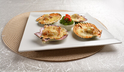 baked cheese cream scallop in shell foie gras canapés in white background asian halal seafood menu