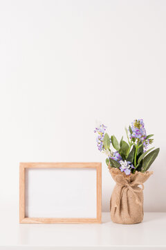 empty photo frame  and  plant in a pot mock up