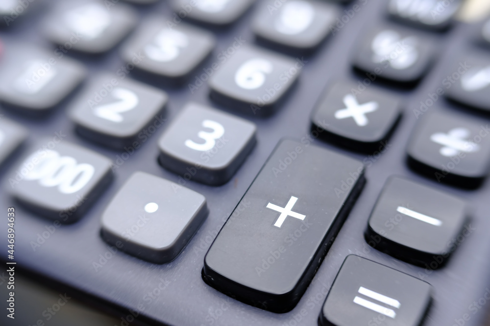 Poster close up calculator on wood table and macro calculator with number, business and finance concept