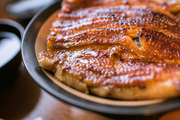 Close up of rice bowl topped with Unagi (grilled freshwater eel) in Japan　ウナギの蒲焼 鰻丼 うな重 クローズアップ