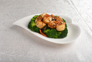 stir fried fresh scallop with mushroom and broccoli in spicy ox sauce in white background asian halal seafood menu