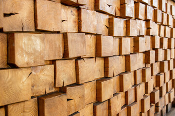 Wooden, textured wall lined with wooden cubes, longitudinal cuts of a fir tree. Cubes in the dioganal projection.