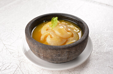 chinese superior double boiled premium shark's fin hot thick soup with crab, prawn and vegetable mushroom with herb in hot stone pot in white background asian halal seafood menu